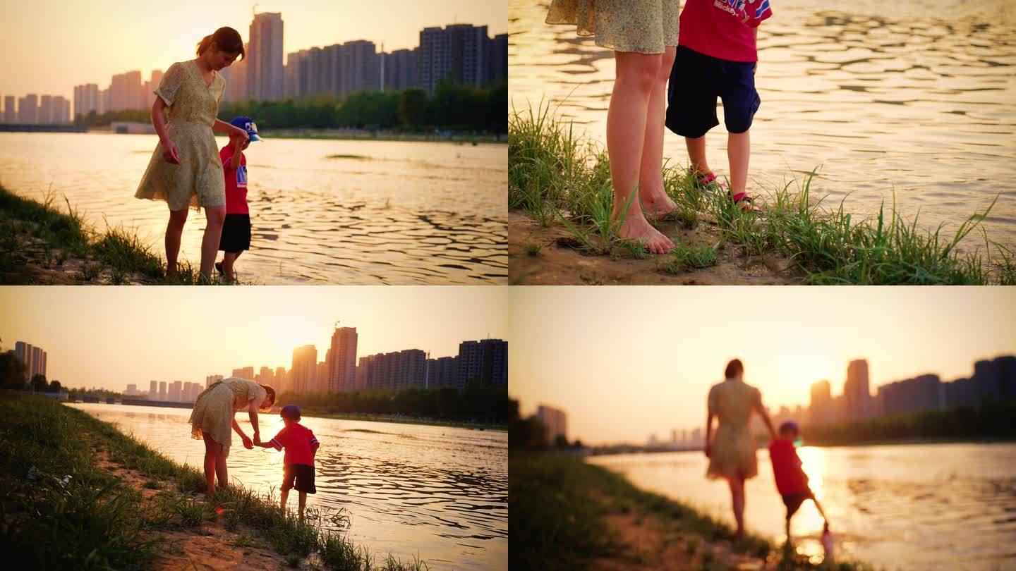 母亲陪伴孩子河边散步 黄昏傍晚 温馨幸福