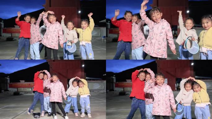 一群藏族小孩子挥手笑脸