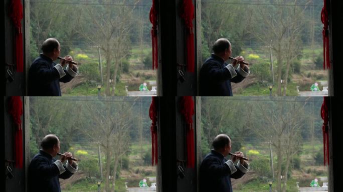 老人老房子笛子演奏吹笛子背影传统乐器横笛