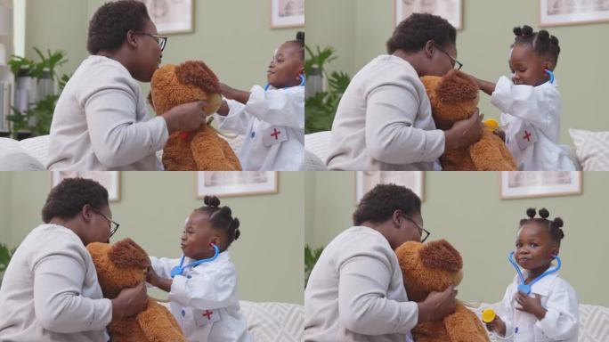 一个小女孩穿着医生服装在家里与母亲和泰迪熊玩耍的4k视频片段