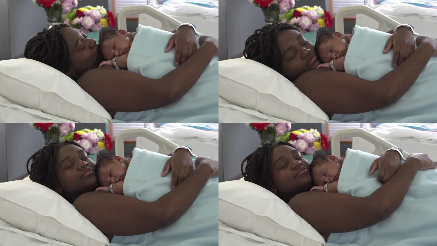 快乐的母亲和她的新生儿睡觉