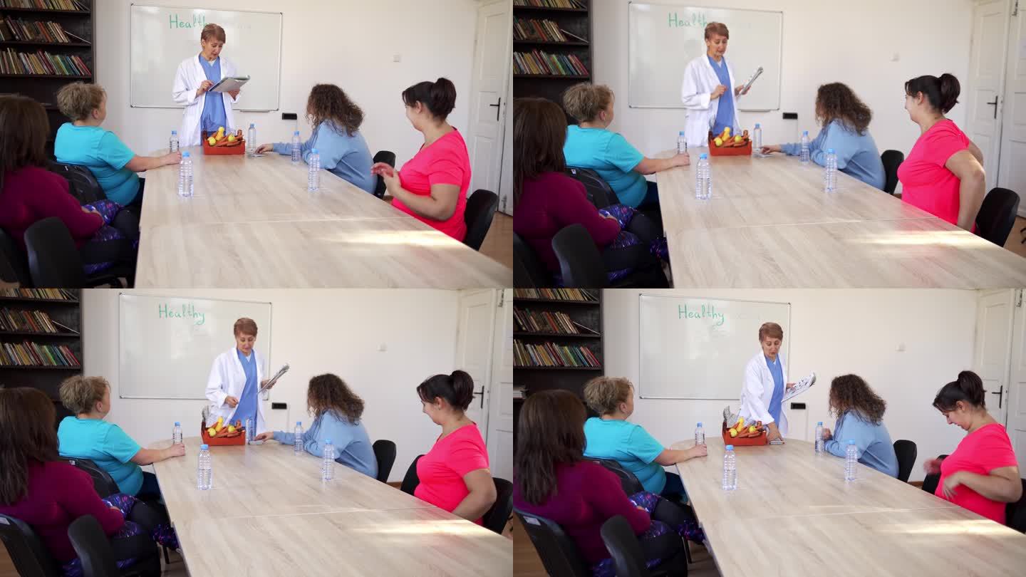 一位营养师正在教一班女士健康饮食和锻炼