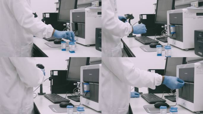 一位英俊的年轻科学家在实验室工作时测试医学样本的4k视频片段