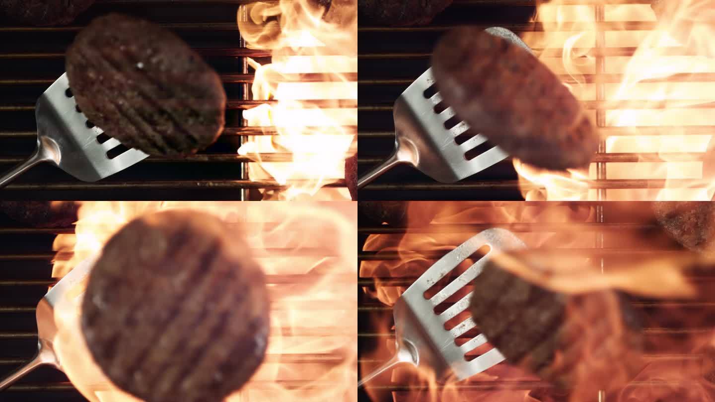 烧烤架上牛肉饼上的火焰超慢动作