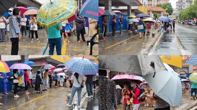 学生放学家长冒雨接小孩子打着雨伞接小学生