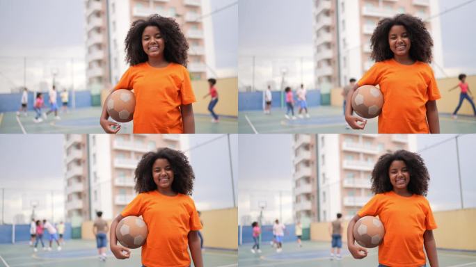 一个女孩在运动场上拿着球的肖像