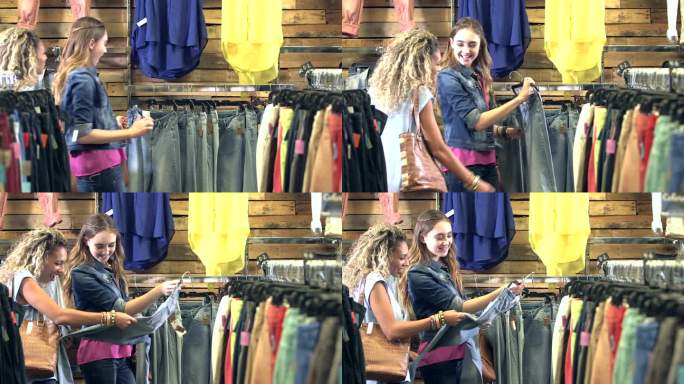 十几岁的女孩在服装店买牛仔裤
