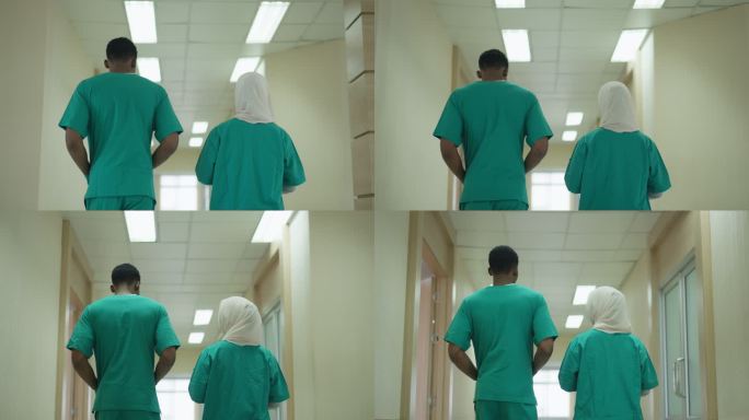 两个护士正走向他们的房间。