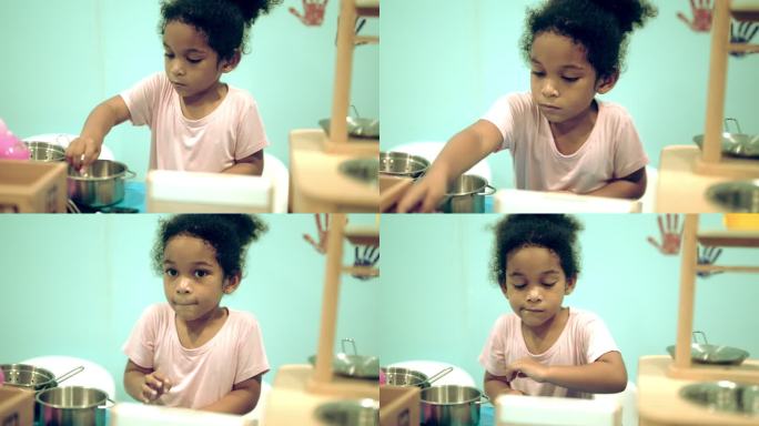小女孩假装是厨师。