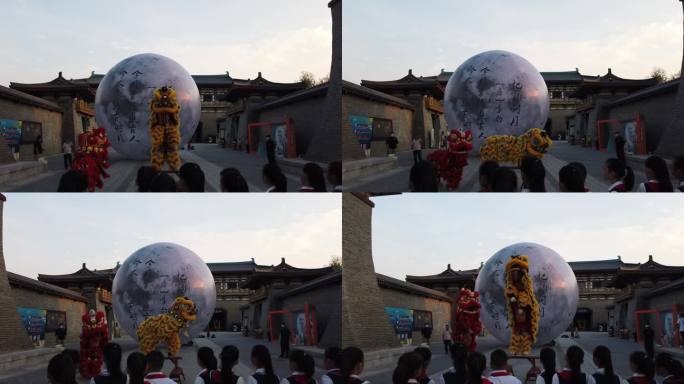 襄阳唐城景区中秋节舞狮超级月亮小学生围观