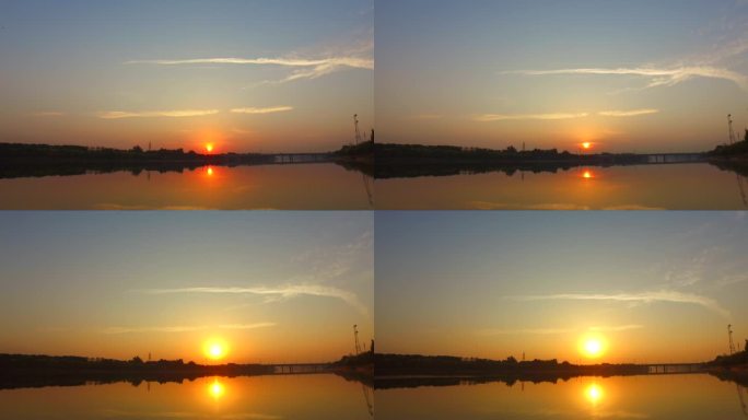 河边日出水天一色水边早晨凌晨太阳照在水面