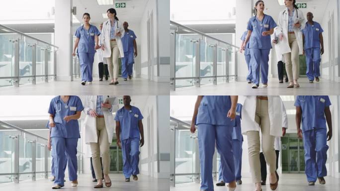 一组医生在医院一起散步时谈话的4k视频片段