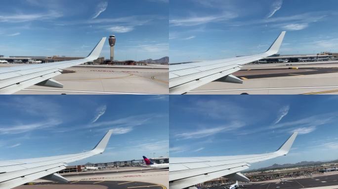 在亚利桑那州凤凰城的凤凰城天空港国际机场，在一个阳光明媚的日子里，一架商用飞机从机翼上起飞