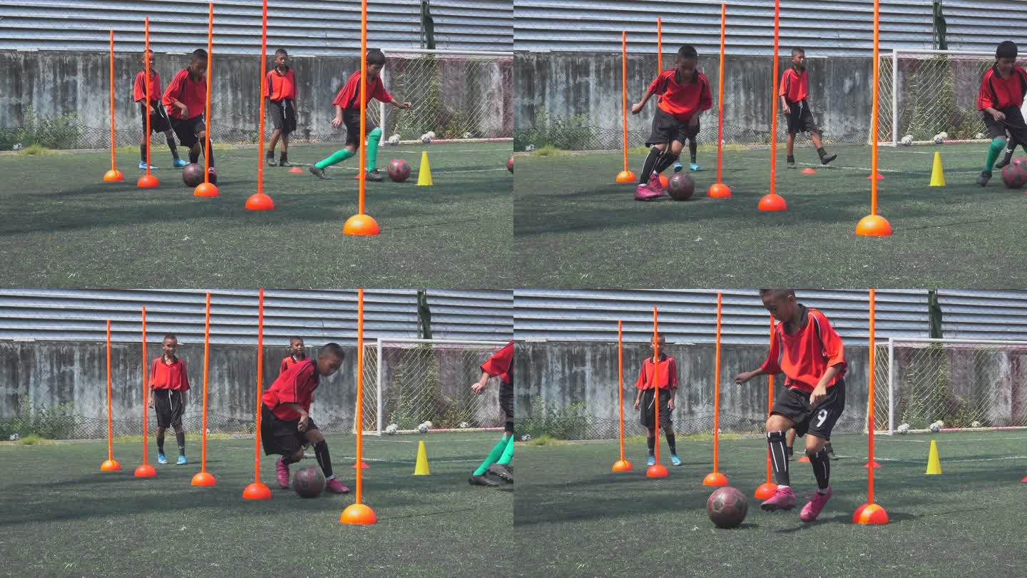 男孩足球运动员在球场上练习慢动作
