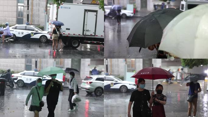 雨天出行、打伞的人