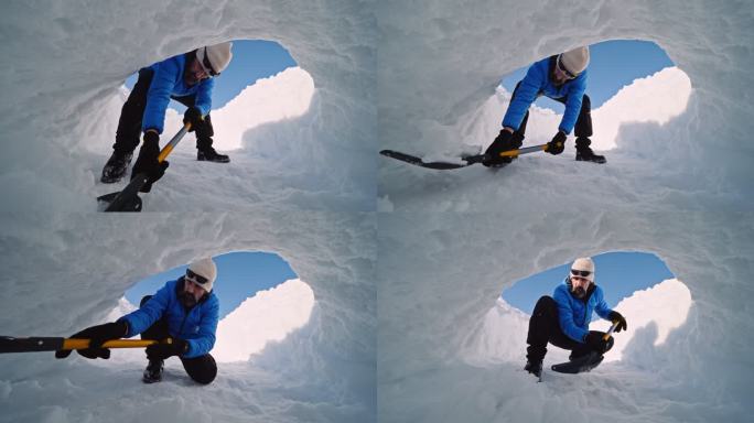 成熟的游客在雪地里为冬季露营挖洞。在自然界中是孤独的。