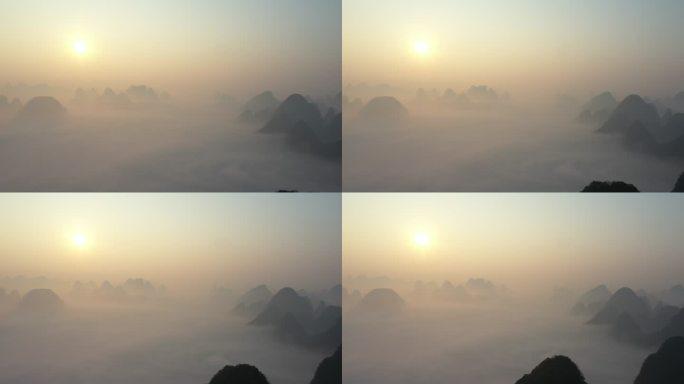 清晨桂林阳朔喀斯特地貌群山上的日出云海