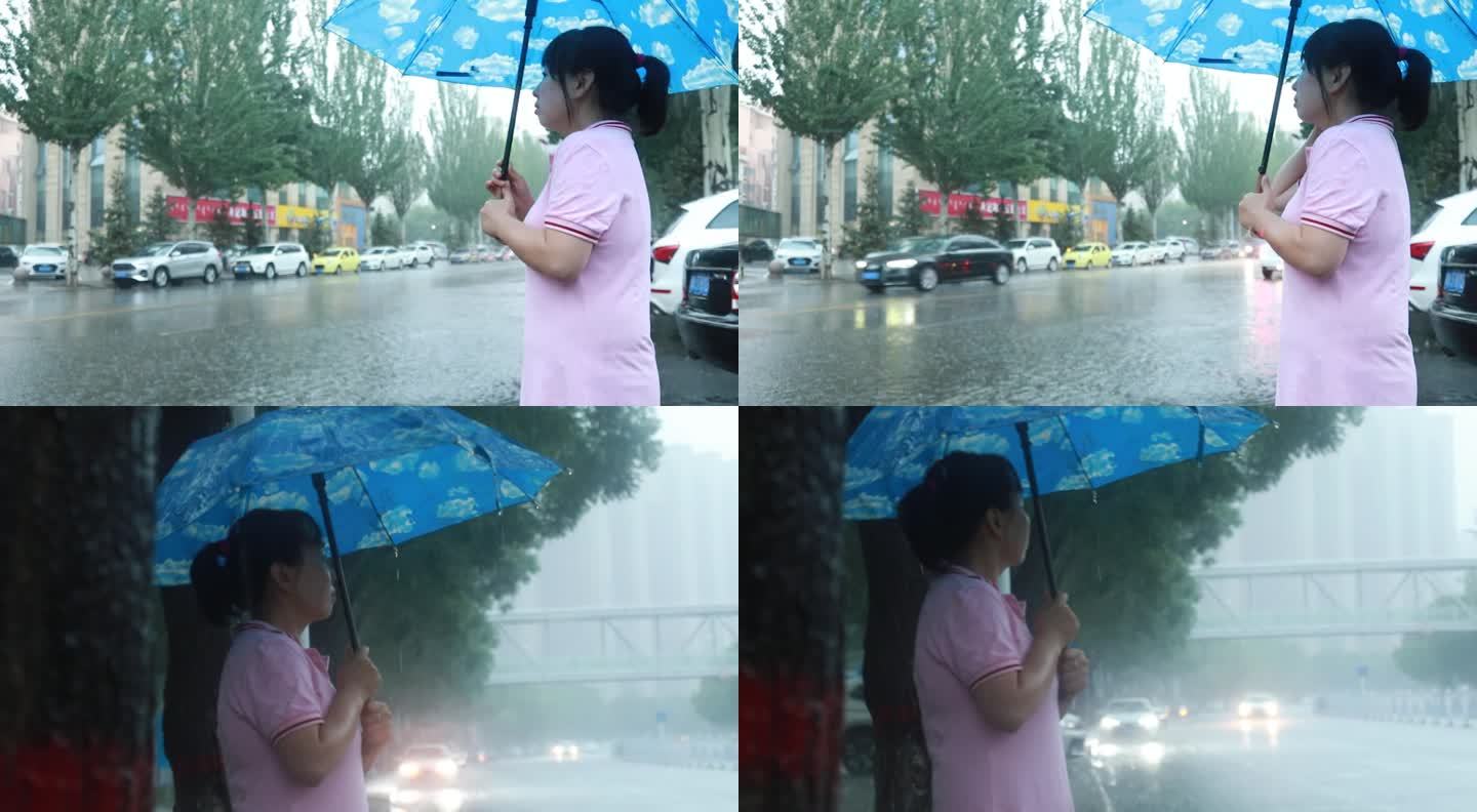 在雨中，一位亚洲妇女撑着雨伞，在等车