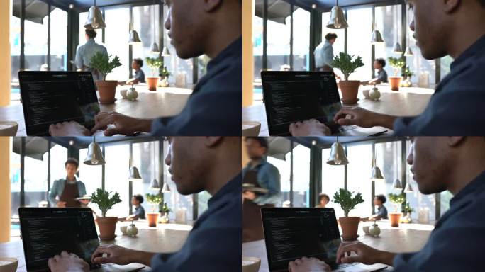 咖啡馆的男人在笔记本电脑上编码