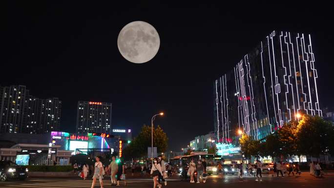 月亮照耀着城市人群-城市月亮中秋团圆