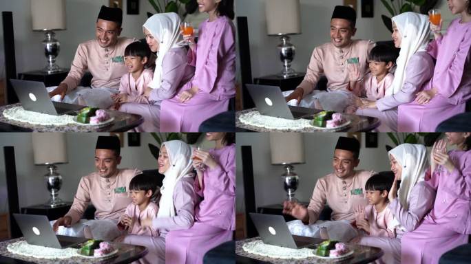 穿着传统服装的马来穆斯林家庭，为开斋节艾迪尔菲特里庆祝活动与朋友和家人视频通话