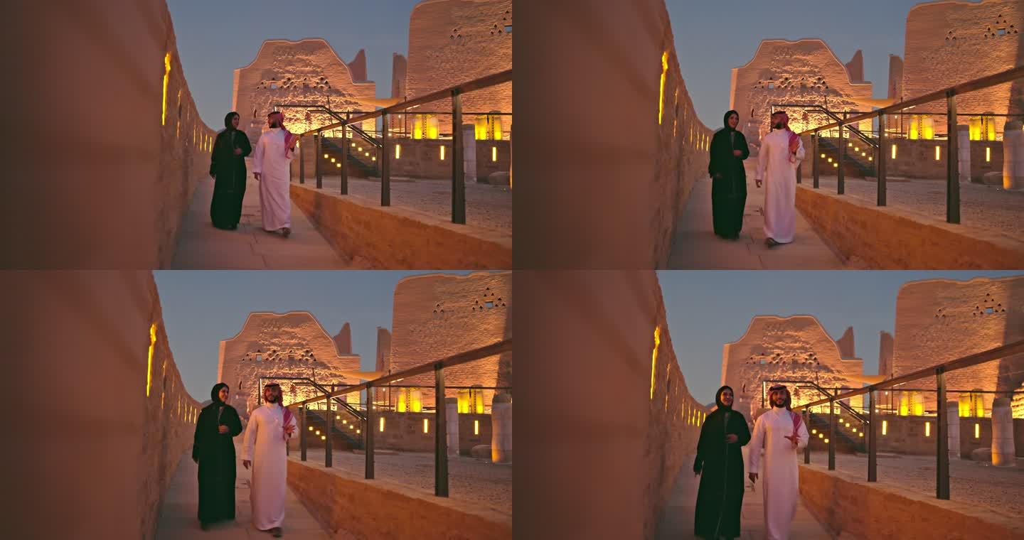 一对30多岁的沙特夫妇在黄昏时分在图拉伊夫废墟享受