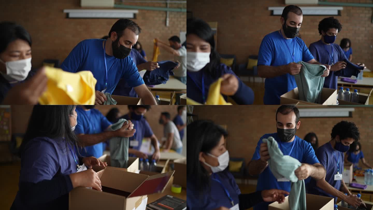 在慈善捐赠中心工作的志愿者-使用防护面罩