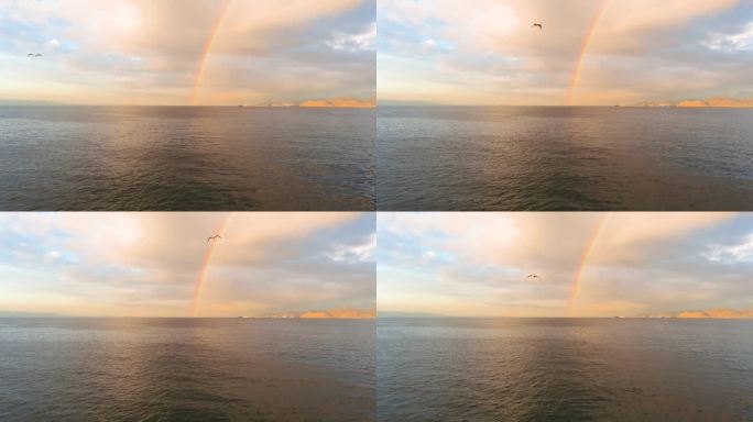 海上的彩虹。雨过天晴航拍海面黄昏彩虹