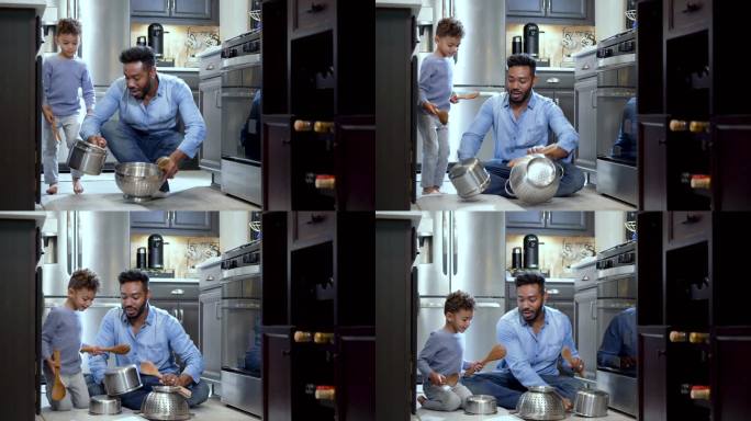 男孩和父亲在厨房地板上用锅当鼓