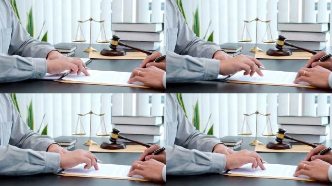 男性律师在办公室签订合同后与客户咨询的4K视频片段