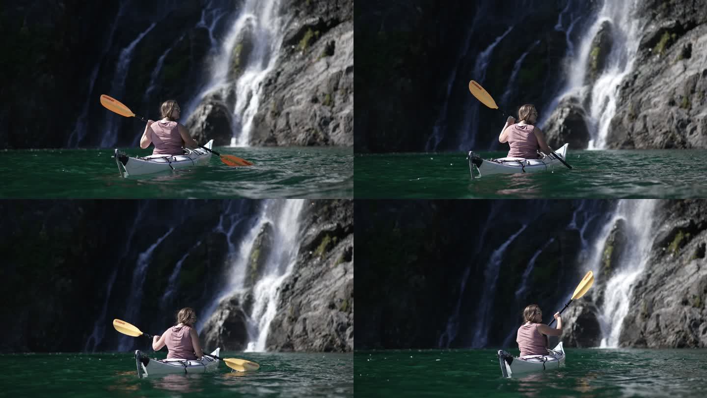 一名女子皮划艇运动员在瀑布附近的独角镜头