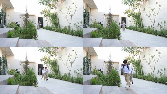 沙特的学童们正爬上台阶走向家门口