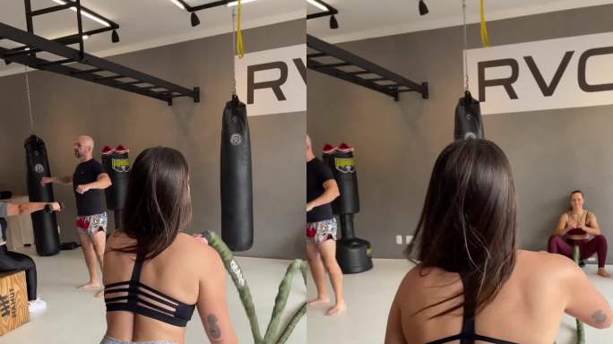 年轻女子在健身房用战绳锻炼并分享-移动拍摄