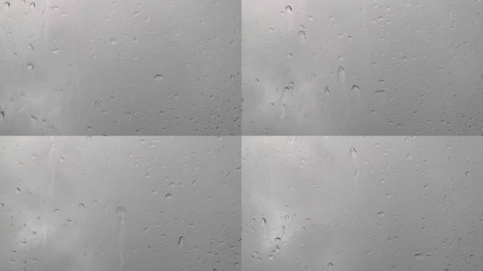 在暴雨中驾驶，雨水拍打天窗