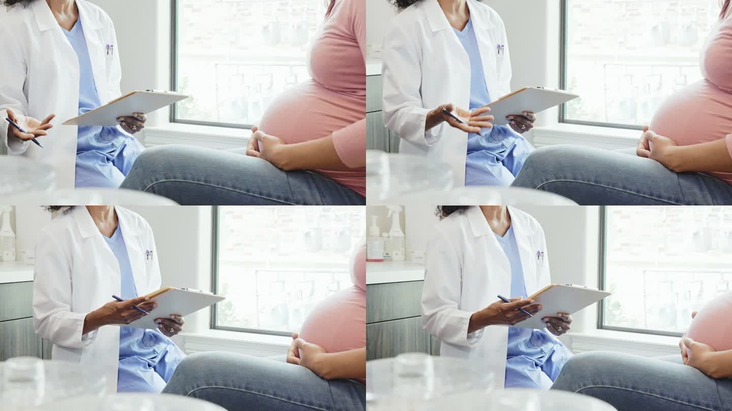 无法辨认的医生在产前检查中与孕妇交谈