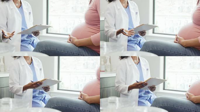 无法辨认的医生在产前检查中与孕妇交谈