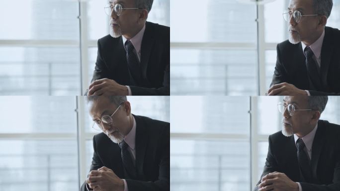 特写镜头：坐在办公室休息室里的亚裔中国CEO和商人双手紧握，目光移开