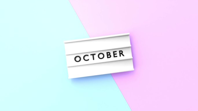 十月文本以4K分辨率显示在蓝色和粉红色背景的灯箱上