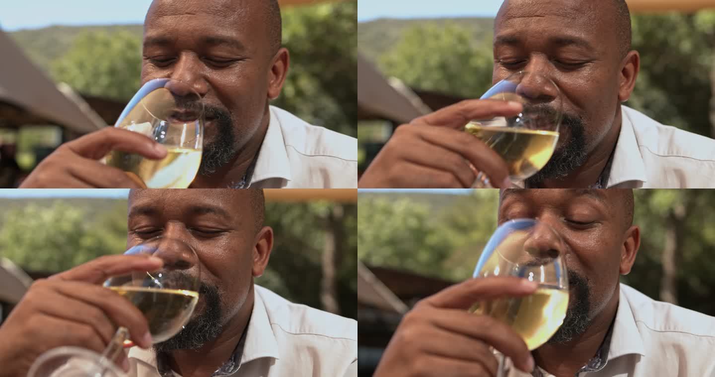 一个成年人独自坐着，一边品酒一边沉思的4k视频片段