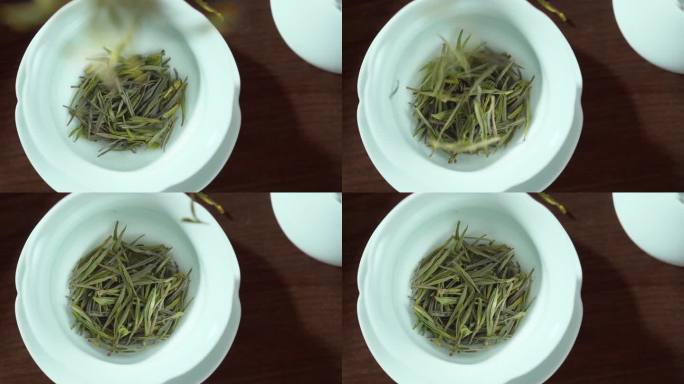绿茶茶叶下落到盖碗里