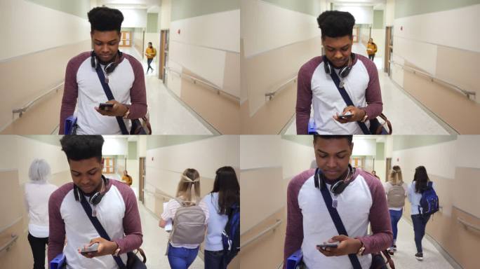 自信的少年在上课的路上使用智能手机