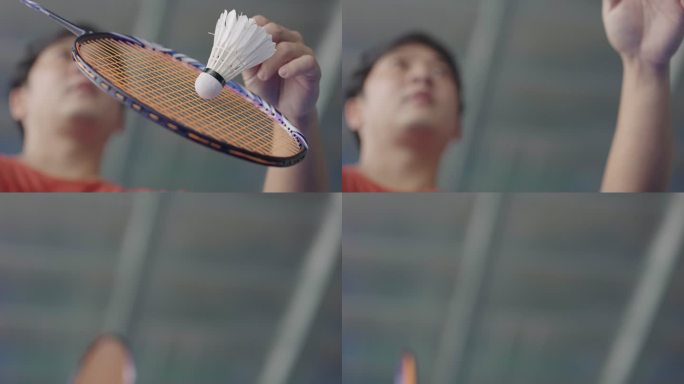 低角度拍摄散焦运动员的脸部，在慢动作中手持羽毛球拍和羽毛球。