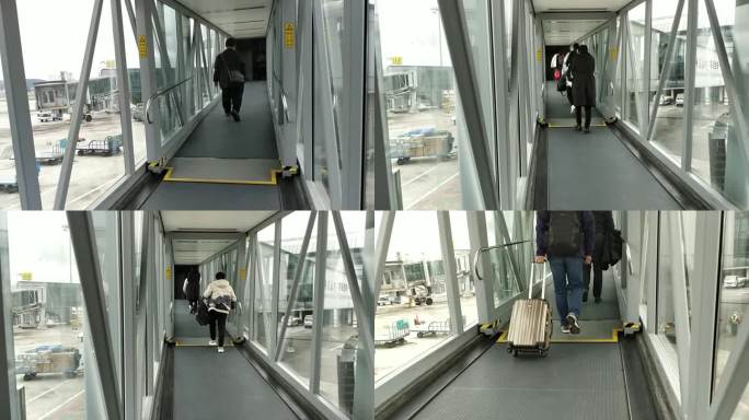 机场人群旅客登机走过廊桥的旅客走过廊桥