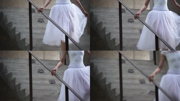 穿着芭蕾舞裙的舞者轻快地走下楼梯