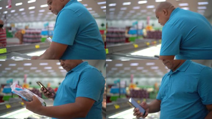 男子在超市使用智能手机扫描产品