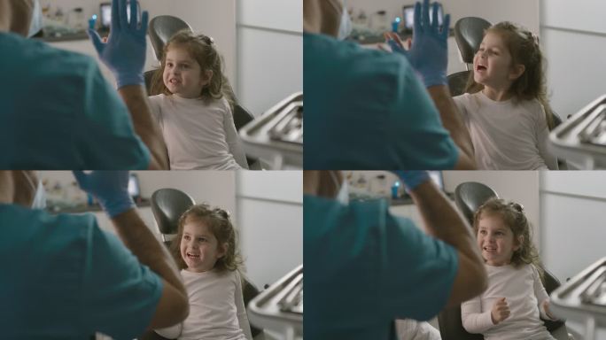 一个可爱的小女孩给牙医击掌的4k视频片段