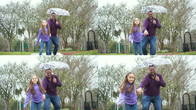 西班牙女孩和父亲在雨中伞下奔跑