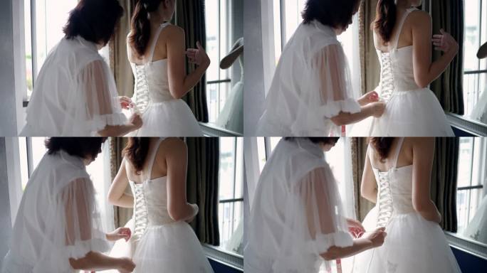 裁缝正在测量身体周围的尺寸，试穿婚纱。