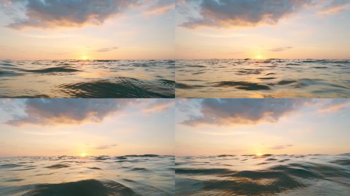 日落在海面上。海岸线海面视角海上日出