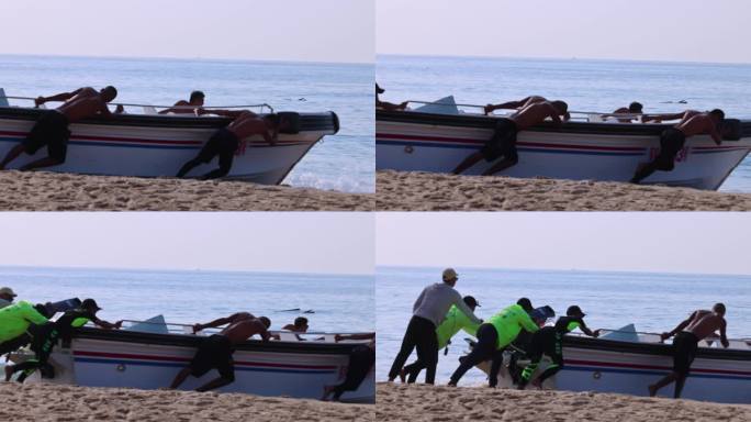 海边沙滩早晨一群男人把船推进大海